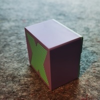 A green AI assistant speaker